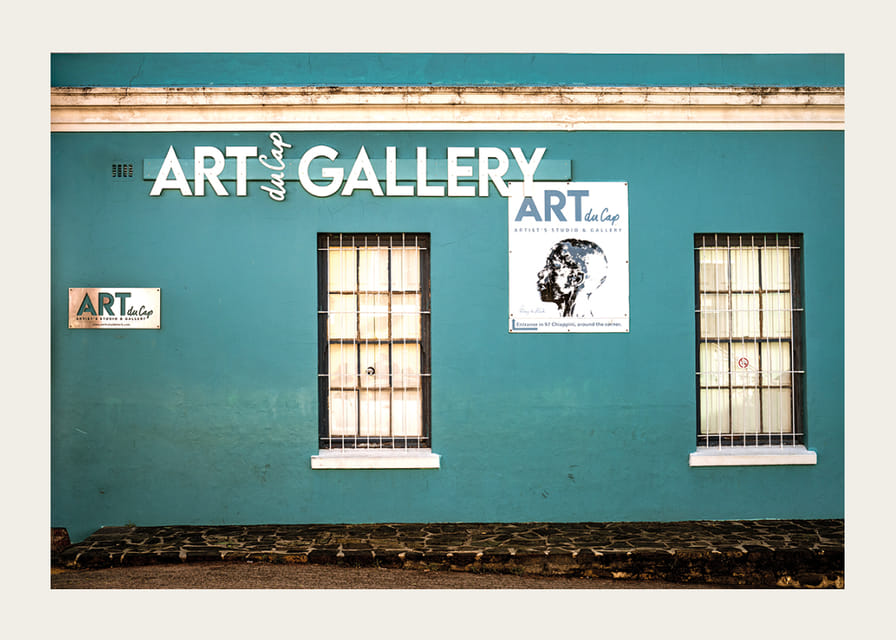 A vibrant turquoise facade attracts visitors to the world of creativity.-12