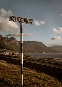 A road sign towards the mountains and the sea in the glow of sunset.-7
