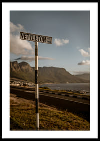 A road sign towards the mountains and the sea in the glow of sunset.-2