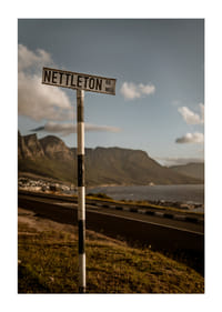 A road sign towards the mountains and the sea in the glow of sunset.-3