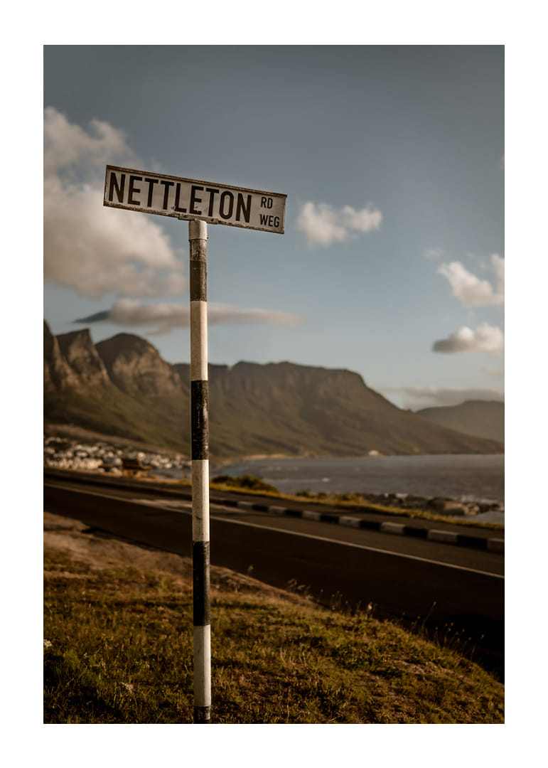 A road sign towards the mountains and the sea in the glow of sunset.-12