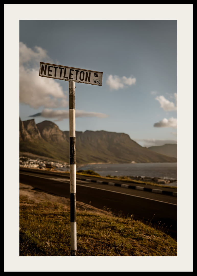 A road sign towards the mountains and the sea in the glow of sunset.-12