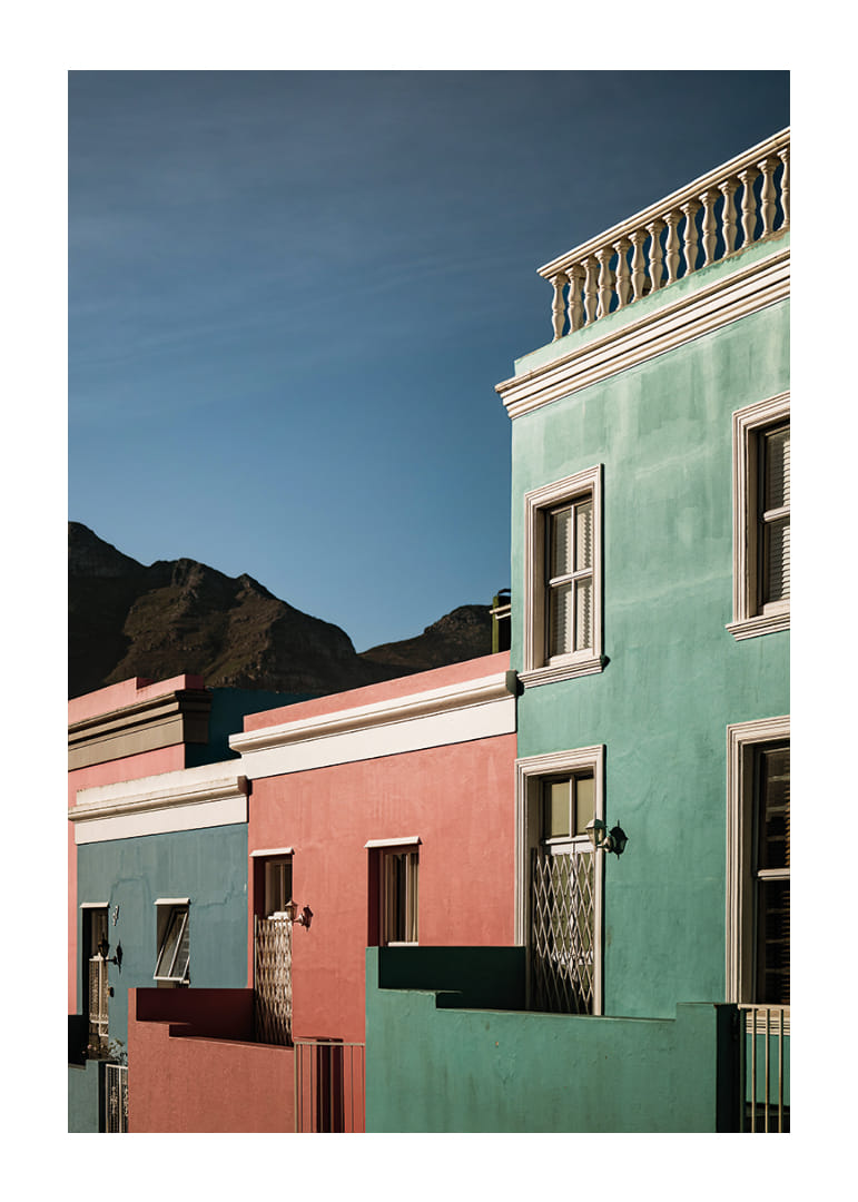 Colorful houses in sharp contrast to the silhouette of the mountains.-12