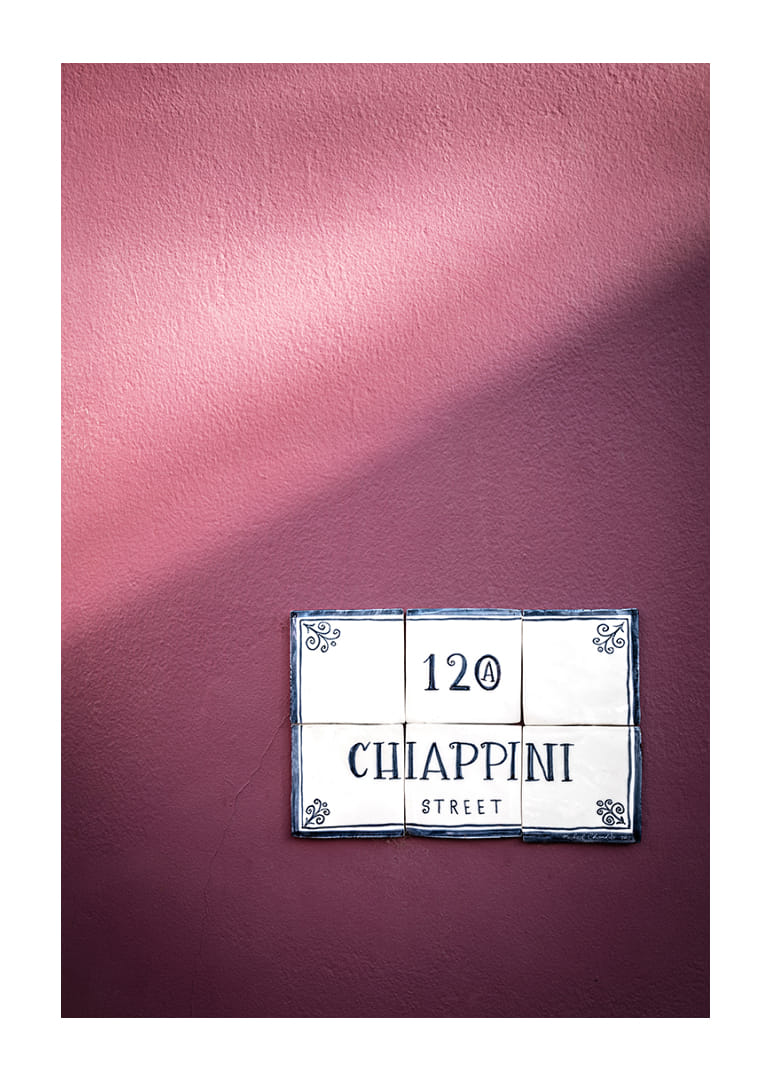 Elegant purple wall with charming street name sign.-12