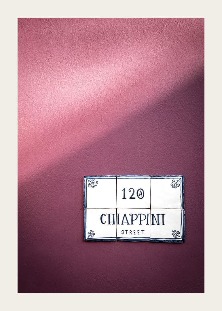 Elegant purple wall with charming street name sign.-12