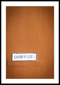 Warm terracotta-colored wall element with stylish street name.-2