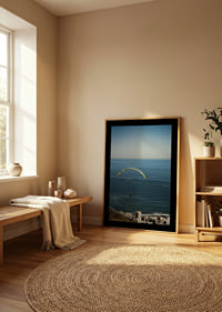 A paraglider soars majestically over the sea and the city.-8