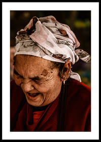 An elderly woman smiles in a warm, rustic atmosphere.-2