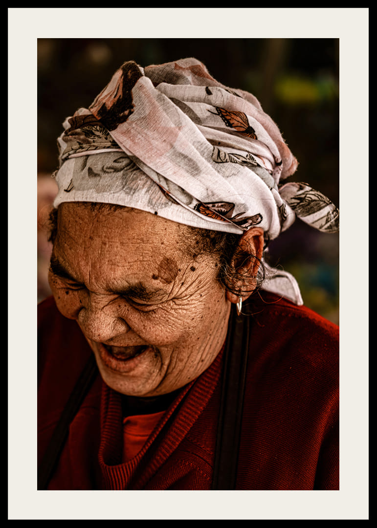 An elderly woman smiles in a warm, rustic atmosphere.-12