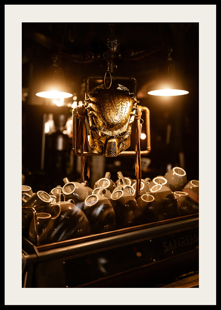 Sparkling mask in warm light above coffee cups.-12