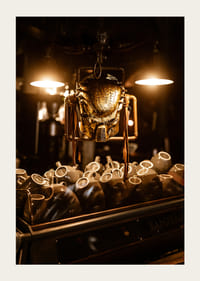 Sparkling mask in warm light above coffee cups.-3