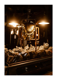 Sparkling mask in warm light above coffee cups.-5