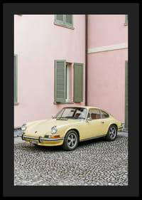 A charming pastel yellow Porsche 911 in front of a pink wall gives a retro feel.-4