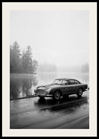 A classic Aston Martin DB5 by a foggy seaway exudes calm and nostalgia.-2
