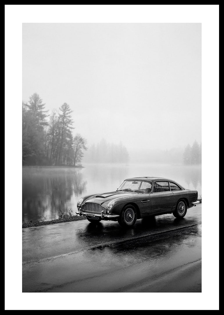 A classic Aston Martin DB5 by a foggy seaway exudes calm and nostalgia.-12