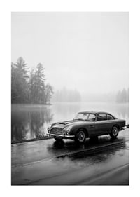 A classic Aston Martin DB5 by a foggy seaway exudes calm and nostalgia.-1