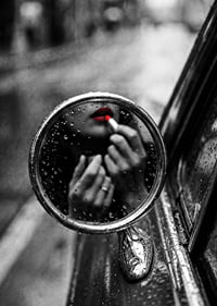 Raindrops on the mirror embrace a moment of seductive beauty.-7