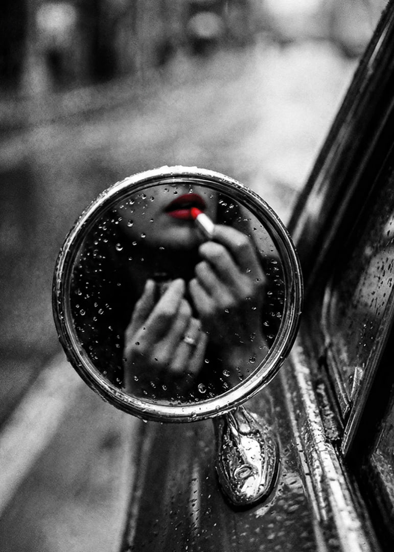 Raindrops on the mirror embrace a moment of seductive beauty.-12