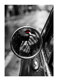 Raindrops on the mirror embrace a moment of seductive beauty.-1