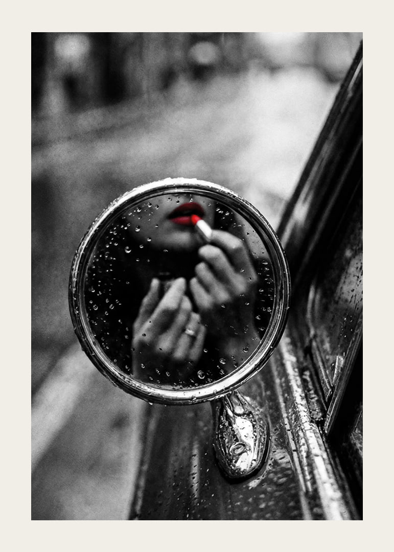 Raindrops on the mirror embrace a moment of seductive beauty.-12