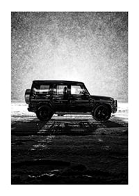 A silhouette of Mercedes-Benz, G-Wagon in snow-filled night creates a sense of adventure.-1