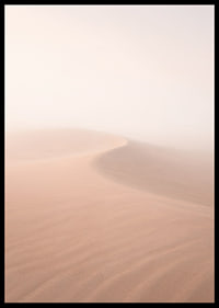 Soft pink sand dunes in a dreamlike desert horizon.-6
