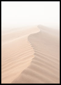 A soft wave of sand sweeps through a desolate landscape.-6