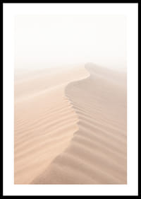 A soft wave of sand sweeps through a desolate landscape.-0
