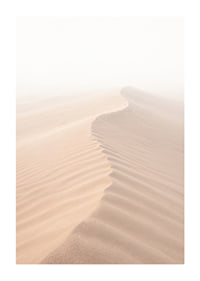 A soft wave of sand sweeps through a desolate landscape.-1