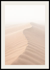A soft wave of sand sweeps through a desolate landscape.-2