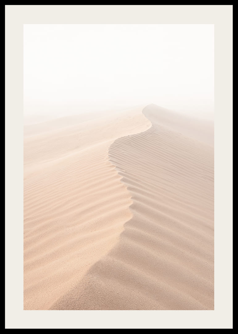 A soft wave of sand sweeps through a desolate landscape.-12