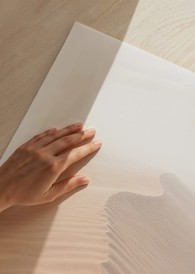 A soft wave of sand sweeps through a desolate landscape.-12