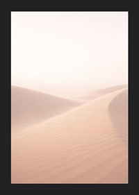 Soft, pink sand dunes create a dreamlike atmosphere.-5