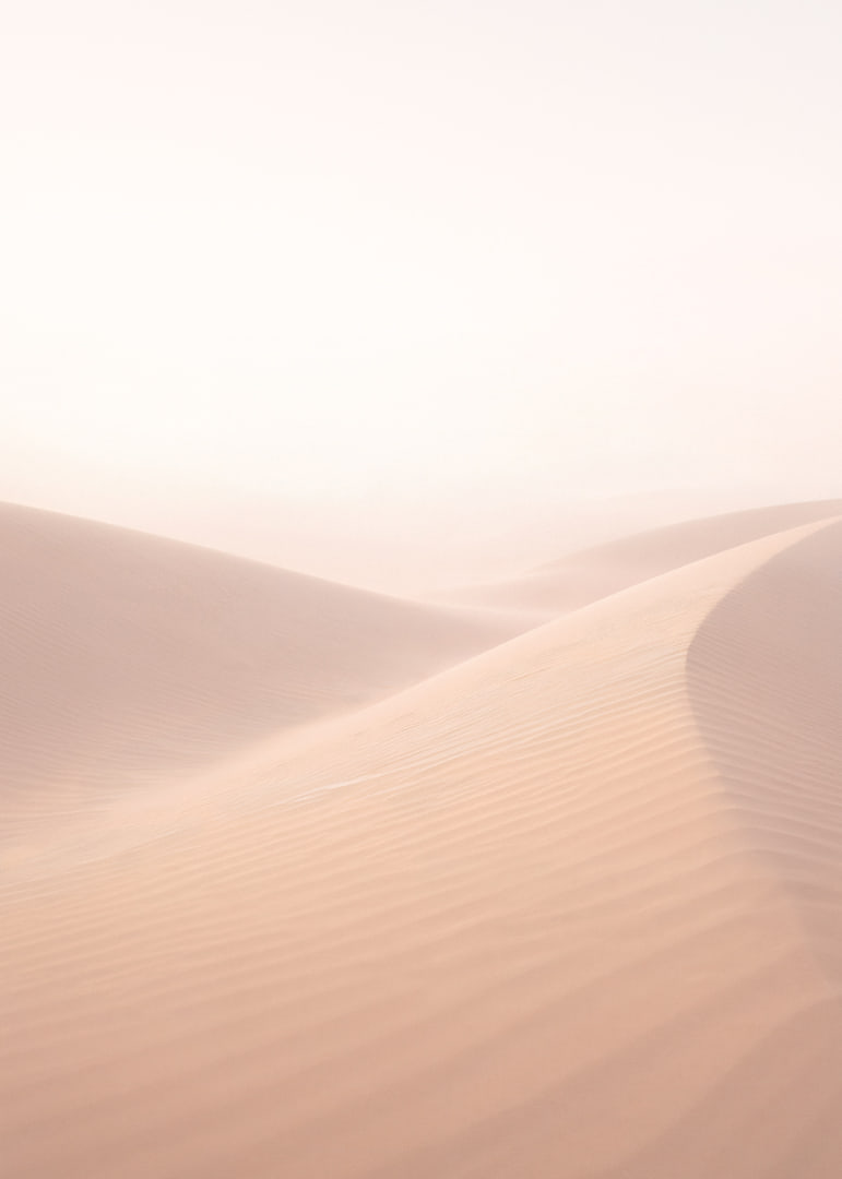 Soft, pink sand dunes create a dreamlike atmosphere.-12
