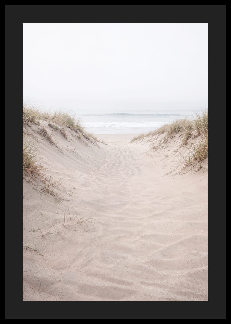 Soft sand leads towards the distant horizon of the sea.-12
