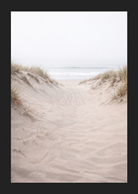 Soft sand leads towards the distant horizon of the sea.-5
