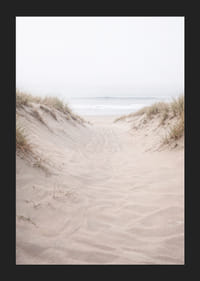 Soft sand leads towards the distant horizon of the sea.-5