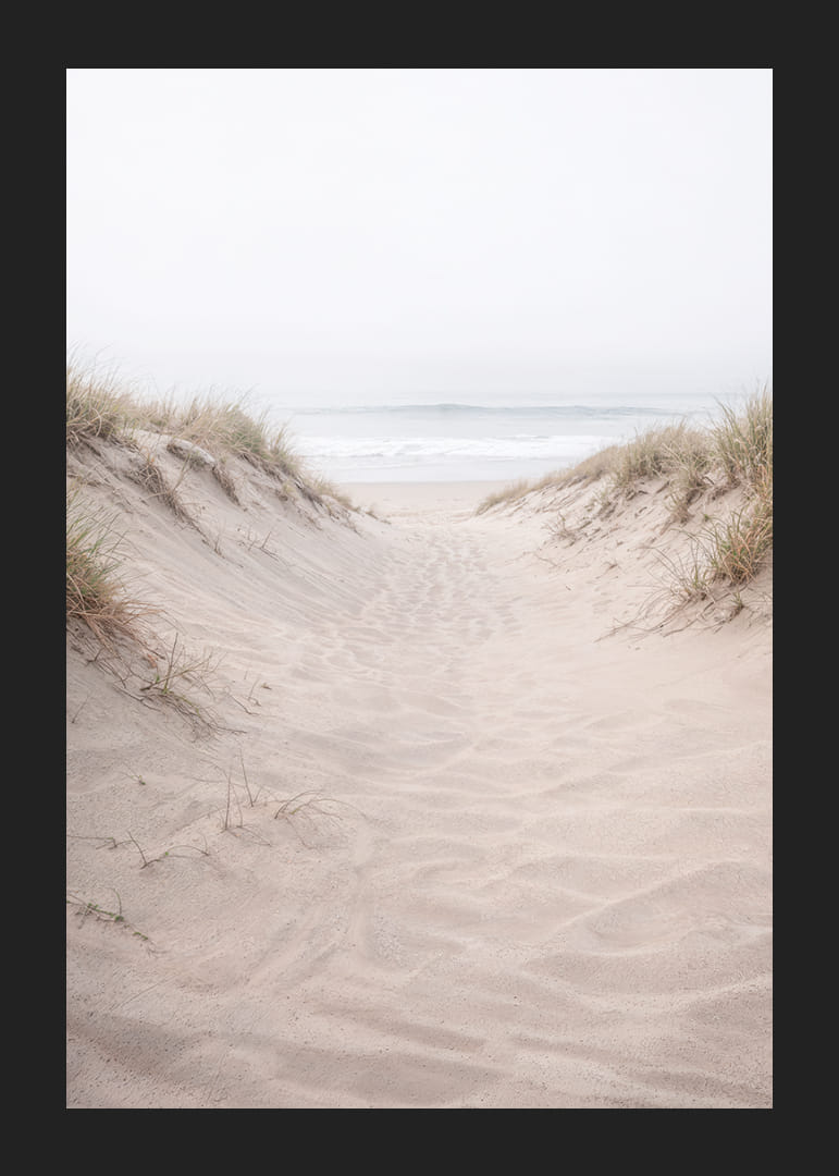 Soft sand leads towards the distant horizon of the sea.-12