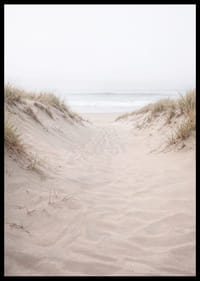 Soft sand leads towards the distant horizon of the sea.-6