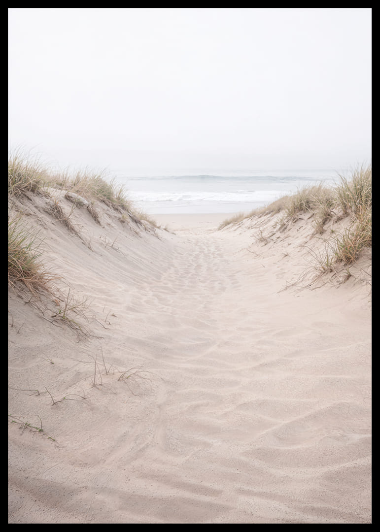 Soft sand leads towards the distant horizon of the sea.-12