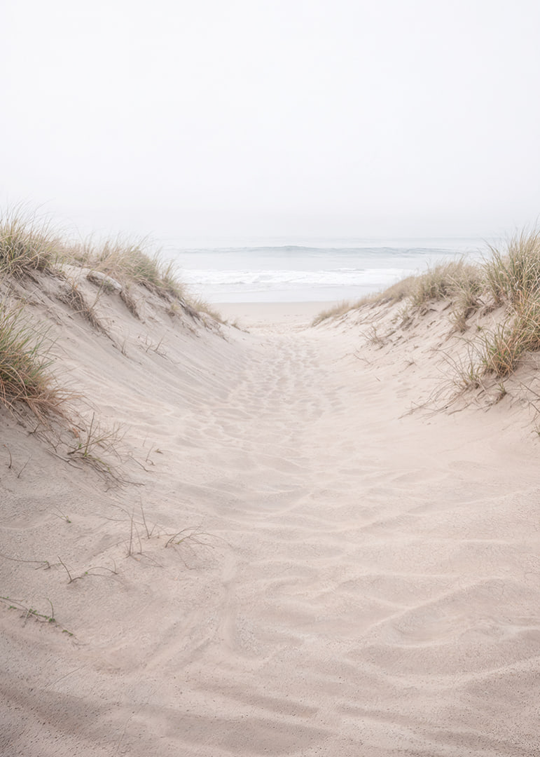 Soft sand leads towards the distant horizon of the sea.-12