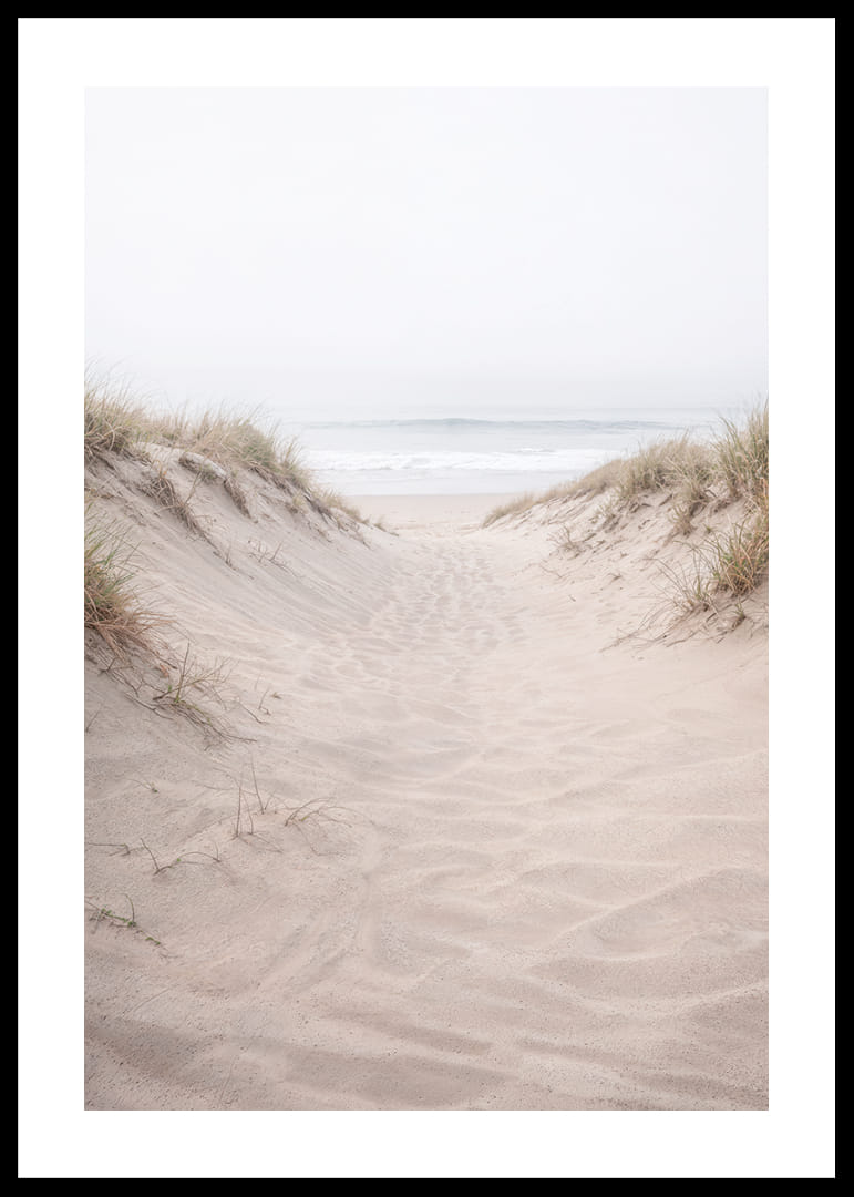 Soft sand leads towards the distant horizon of the sea.-12