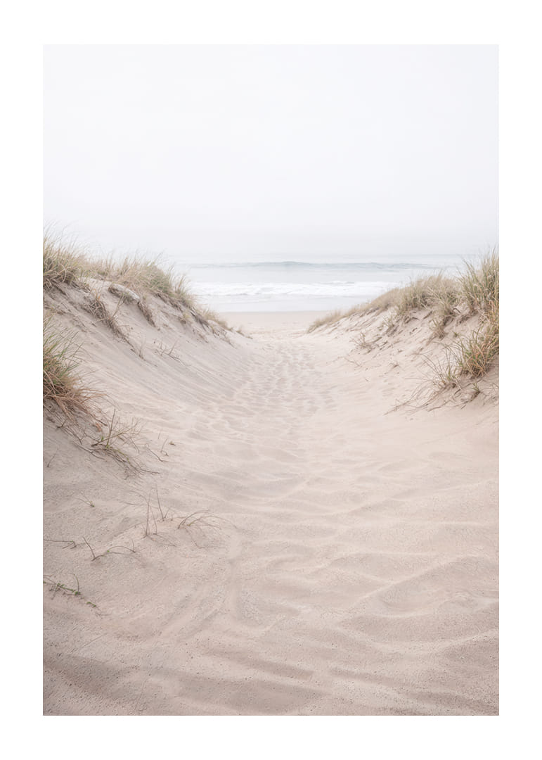 Soft sand leads towards the distant horizon of the sea.-12