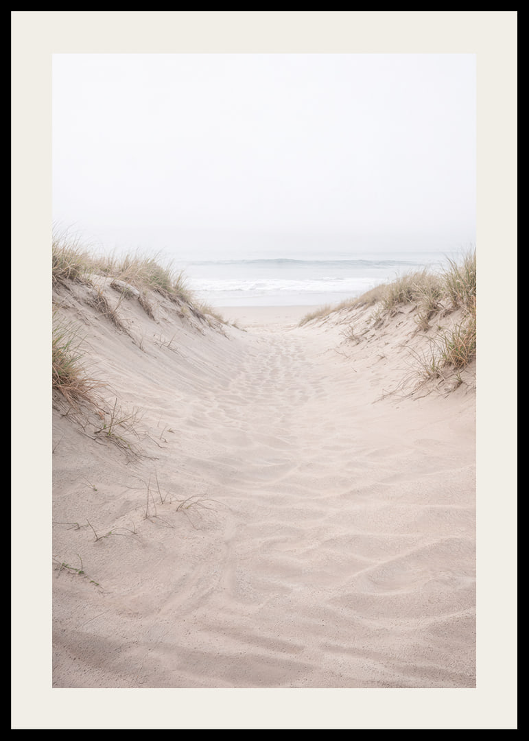 Soft sand leads towards the distant horizon of the sea.-12