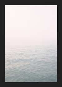 Calm sea view meets bright sky in fog.-5