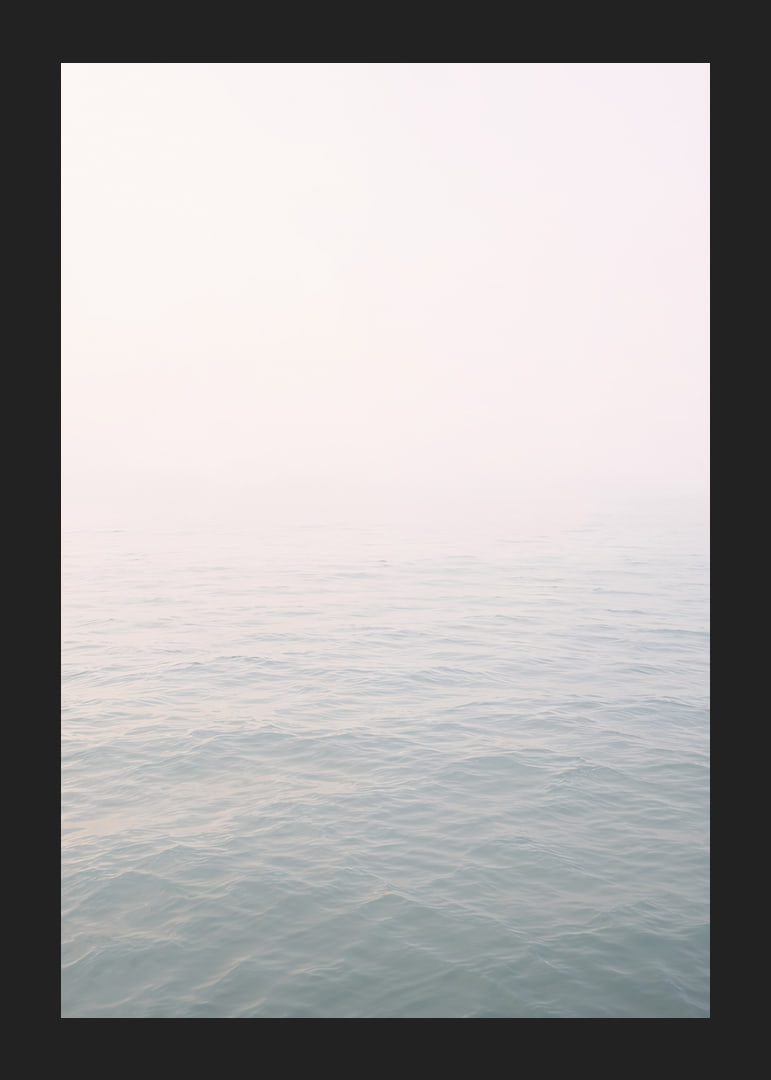 Calm sea view meets bright sky in fog.-12