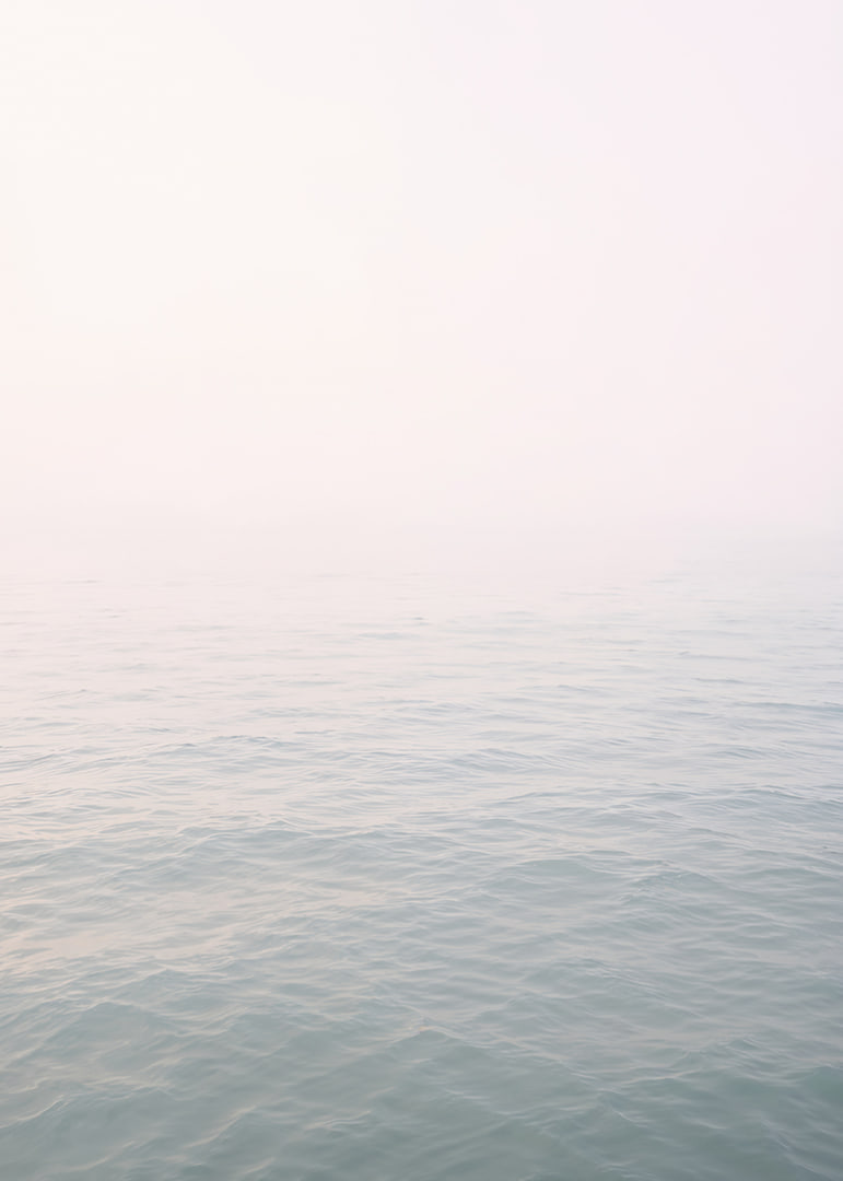 Calm sea view meets bright sky in fog.-12