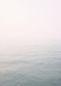 Calm sea view meets bright sky in fog.-7