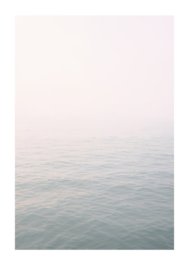 Calm sea view meets bright sky in fog.-12