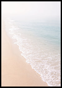 Gentle waves roll in towards the misty coast.-6